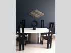 Black Granite Abstract mounted on turning pin and sunk into black marble (on table)