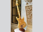 To Scale Fender styled Guitar out of Yellow Translucent Calcite mounted with a turning pin on a mahogany base
